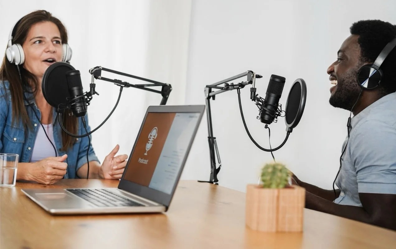 two people chatting with microphones