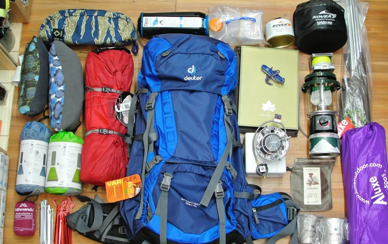 camping gear laid out on the floor